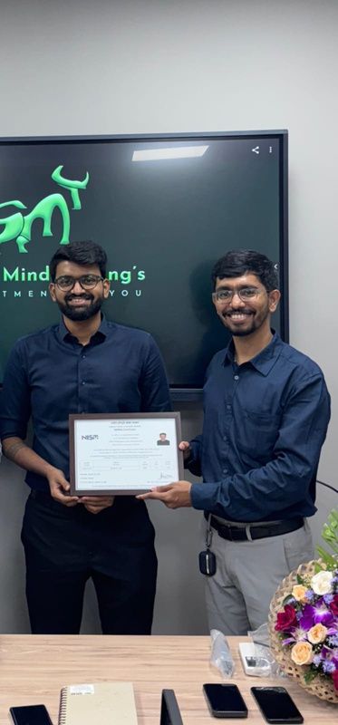 Trainer presenting a certificate to a student